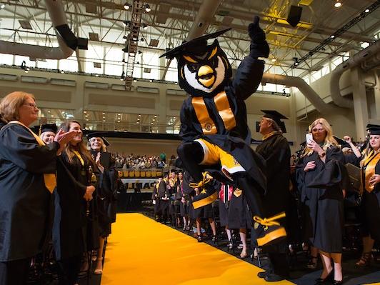 Scrappy celebrating at graduation.